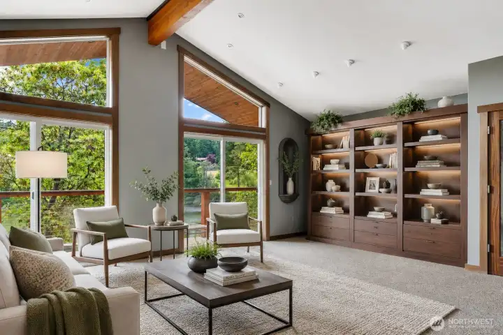 Virtually staged bonus room above the two car garage. The Shelving unit is a Murphy bed.