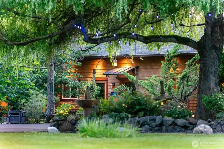 A cedar-sided guest house and boat house sit quietly within the landscape, extending the property’s warm Northwest character and sense of retreat. Together, they create flexible space for visiting guests, shoreline storage, and easy access to the water.
