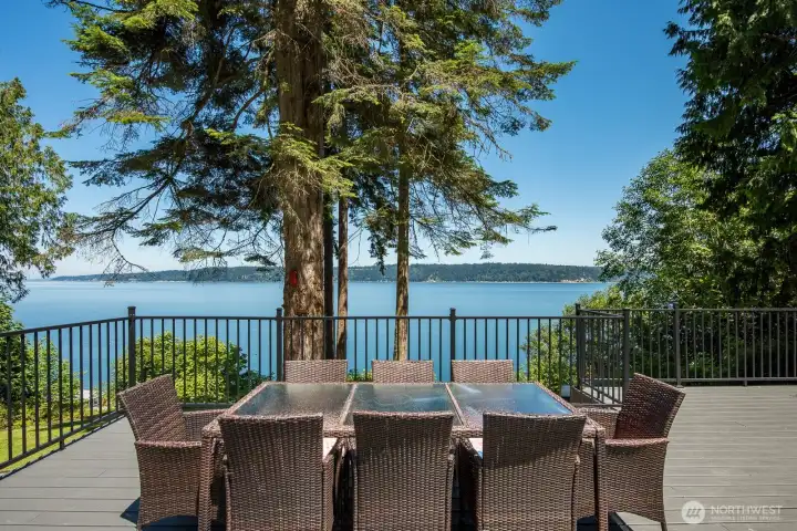 The oversized Trex deck extends your living space outdoors, creating the perfect setting for waterfront entertaining and relaxing with panoramic bay views.