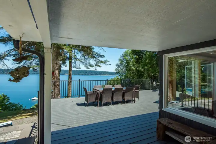Host unforgettable gatherings on the expansive deck, where panoramic Port Susan Bay views create the perfect backdrop for waterfront dining and entertaining.