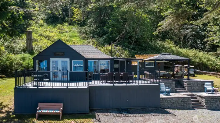 Turnkey waterfront cabin with 2 bedrooms, 1 bath, expansive outdoor living spaces, and a large private lot offering room to relax and enjoy island living.