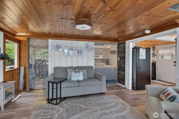 Open-concept living room leads to two cozy bedrooms.