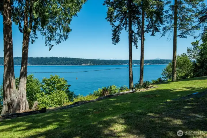 A peaceful, park-like setting with panoramic views of Port Susan Bay and the Cascade Mountains creates the perfect place to relax and enjoy island living.