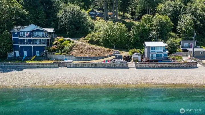 Escape to your own Pacific Northwest waterfront retreat, where privacy, towering evergreens, and spectacular shoreline create the perfect island getaway.