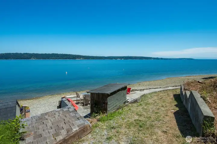 Enjoy 80 feet of bulkheaded waterfront with tideland rights, private beach stairs, a shoreline storage shed, and endless opportunities for beachcombing, kayaking, and waterfront recreation.