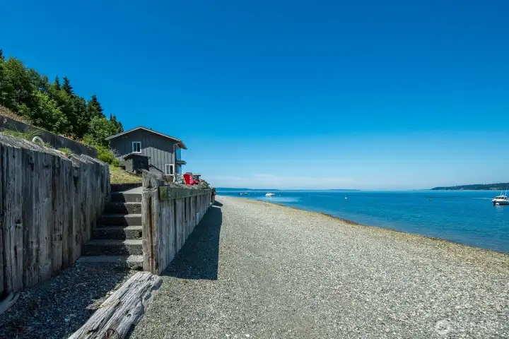Enjoy effortless waterfront living with a beachside patio just steps from the shoreline and your private beach access.