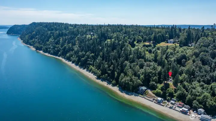 Experience the best of Tyee Beach with a rare combination of privacy, expansive grounds, and spectacular waterfront living.