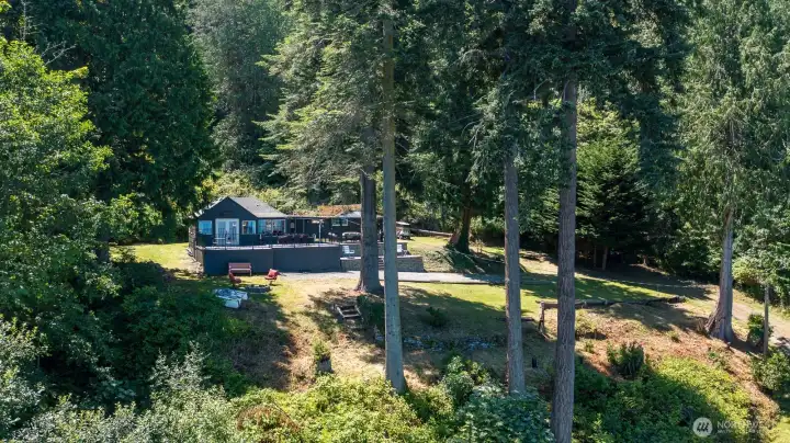 Experience the best of Tyee Beach with a rare combination of privacy, expansive grounds, and spectacular waterfront living.