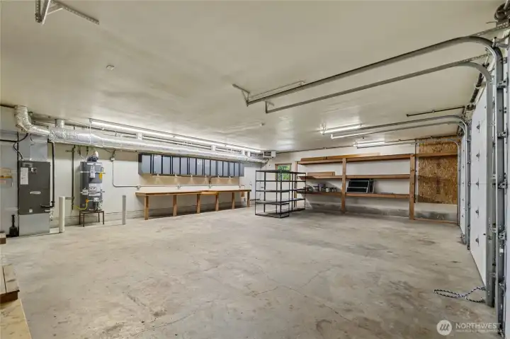 Huge three car garage. Tons of storage for all your toys. 1/2 bath off to the corner (not pictured). Huge three car garage. Tons of storage for all your toys. 1/2 bath off to the corner (not pictured).