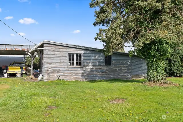 Detached shop. Was once a studio apartment. Has since been gutted and been empty/used for storage since.