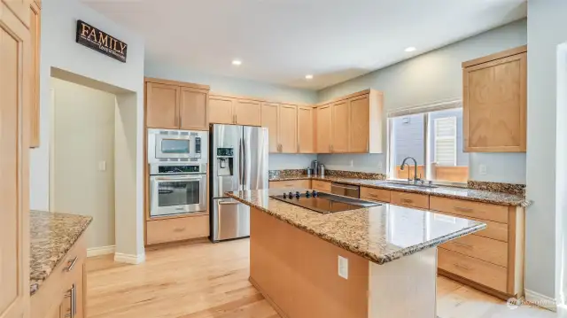 The kitchen is a pleasure to prepare meals and is wonderful for friends and family to gather in. The kitchen has been updated with granite counters, new fixtures and newer appliances.
