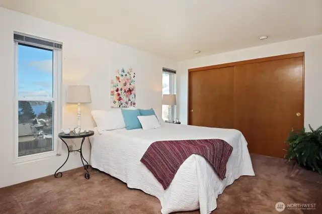 Primary Bedroom with groovy mauve carpet.
