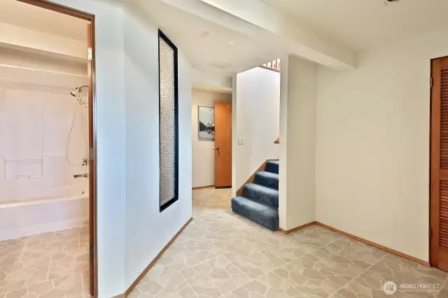 The lower level offers a full bath and two bonus rooms.