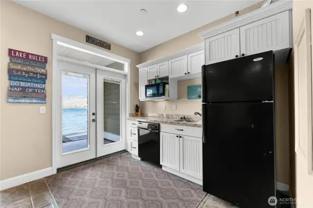 wet bar with french doors to beach