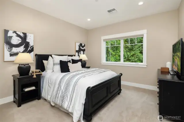 Guest Bedroom #1 on the upper level with large closet and ensuite bath.