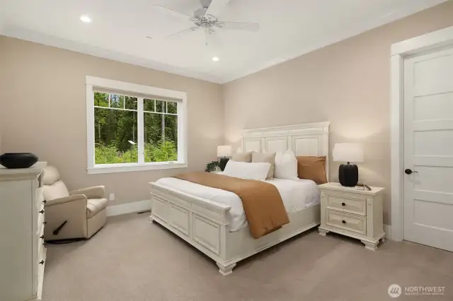 Main level Primary Suite with large walk in closet and beautiful backyard views.