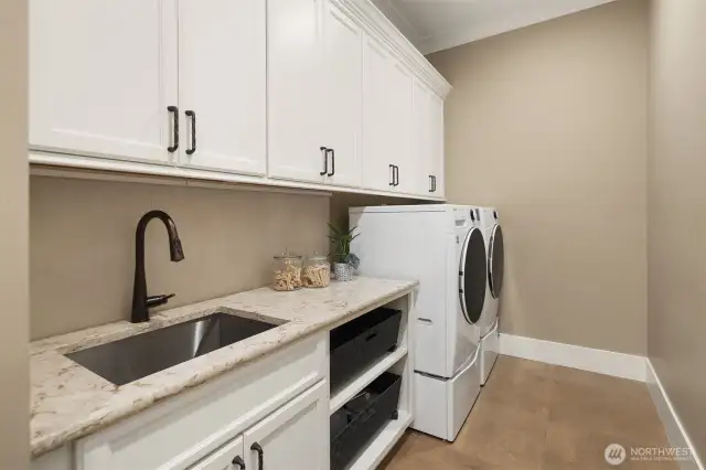 Main level mudroom off the garage.  Laundry room #2.