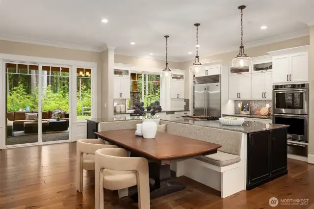 Chef's kitchen is the heart of the home with high end appliances, built in banquette seating and 2 large pantries.  Opens up to covered outdoor entertaining area