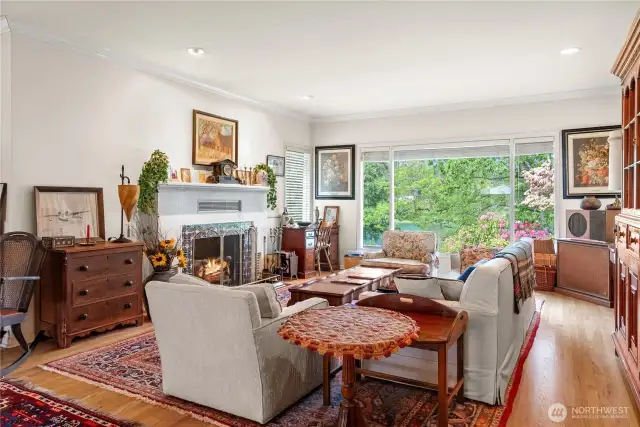 Elegant living room with crown molding and wood burning fireplace