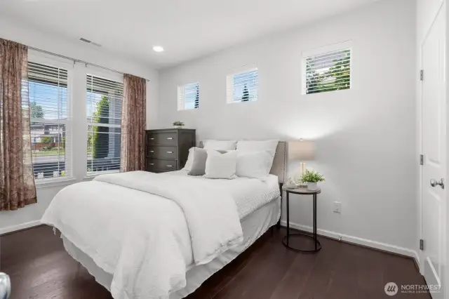 MAIN FLOOR BEDROOM (or den/office/work-from-home space) with walk-in closet & adjoining 3/4 bathroom!