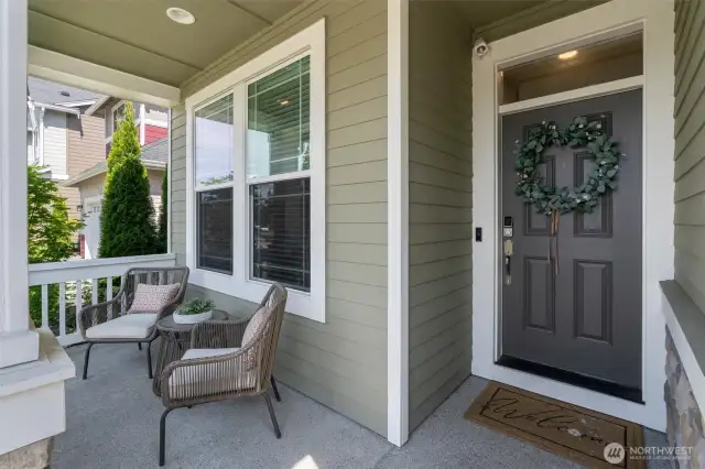 A charming covered front porch welcomes you home & keeps your packages dry!