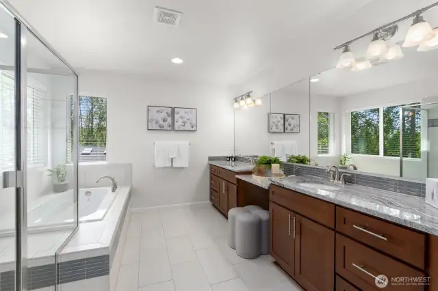Spa-inspired primary bathroom complete with a double sink vanity, soaking tub, walk-in shower and separate toilet room!