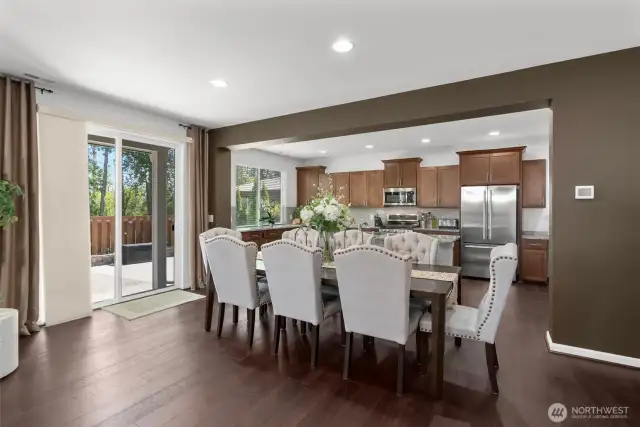 The spacious dining area is ideal for entertaining, hosting holidays, or everyday living! This layout offers stylish finishes and easy access to the backyard patio!