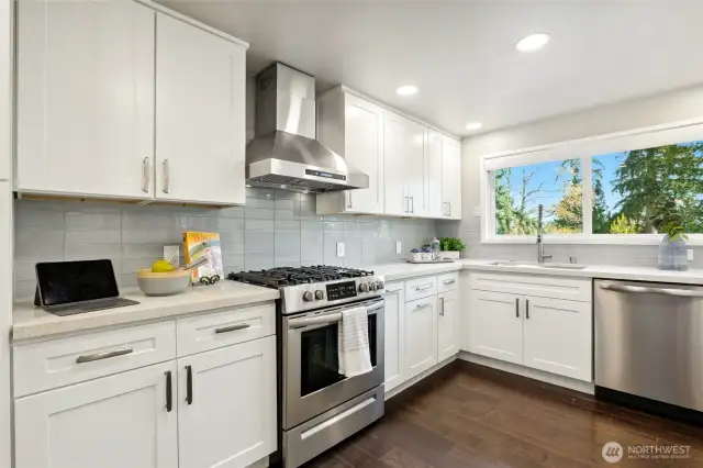 Spacious chefs' kitchen with 5 burner stainless steel range, dish washer and three drawer LG refrigerator, "mealtime made easiier"...