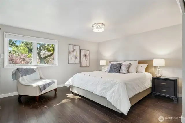 Main floor primary bedroom suite, Automatic remote control window shades in most rooms upstairs and downstairs can be internet programmed...