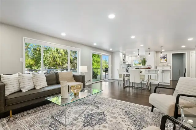 A Wall of windows lets in abundant light with a sliding door to the oversized east facing deck...