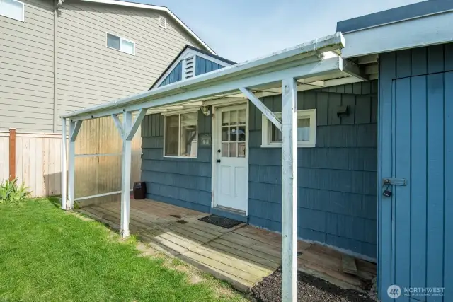 Back porch and storage area has a brand new water heater.