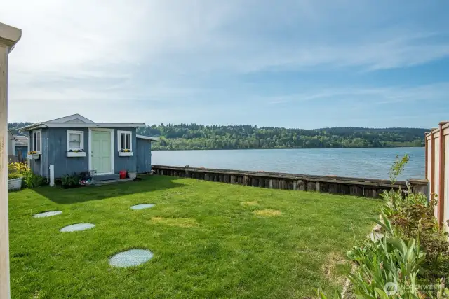 Looking towards the guest bungalow and out into Triangle Cove.  Bulkheads in the front towards the beach and the back.