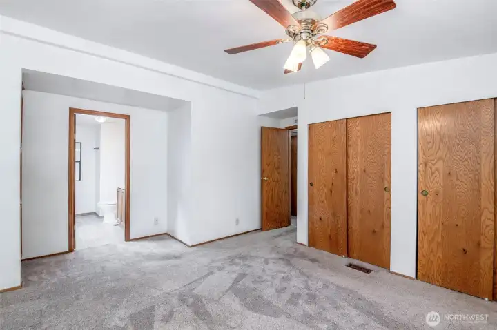 Primary bedroom with double closets and ensuite.