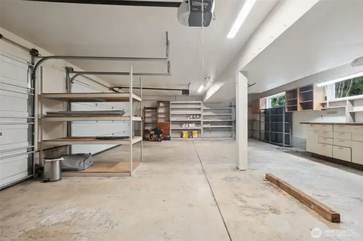 Super BIG 3-car garage with installed cabinets + shelving with room for plenty of tools & storage