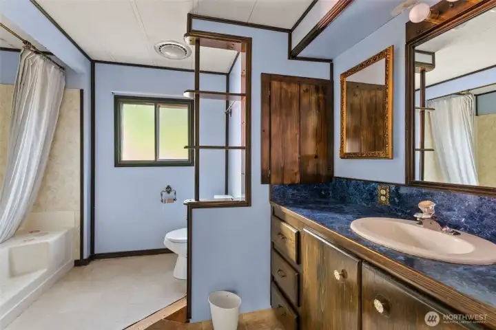 Primary Bath with bath and 3/4 shower.