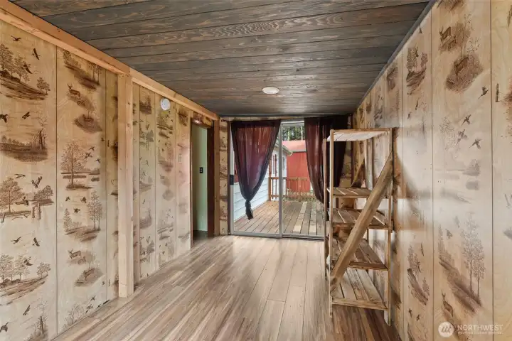 Den/Craft/Office space opens to deck.