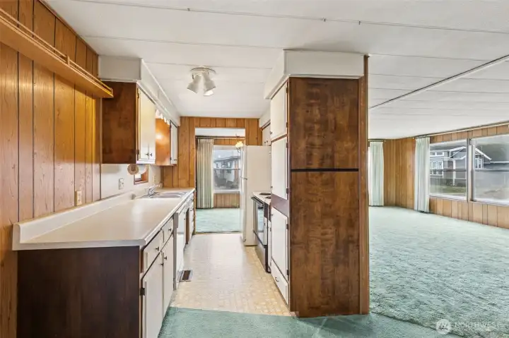 Kitchen w/partial view of the living room.