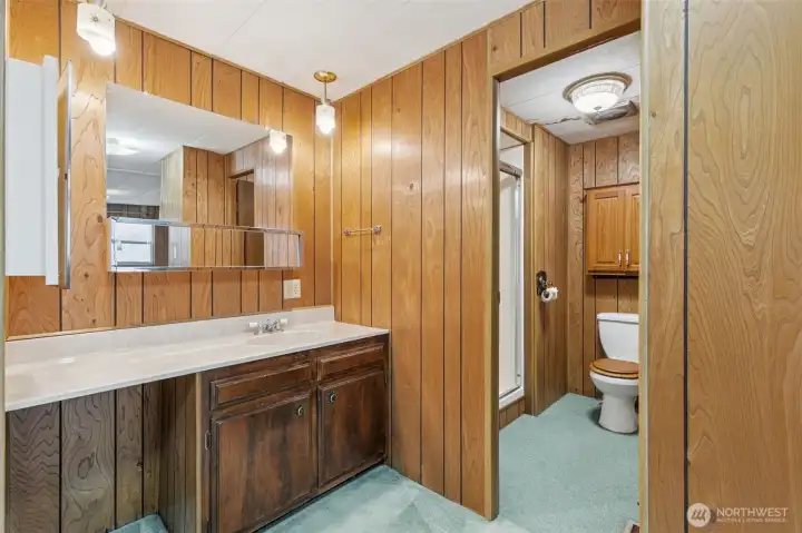 This is the bathroom in the primary bedroom. A walk in shower!