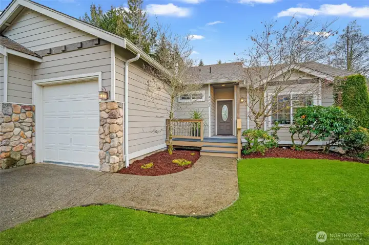 Inviting curb appeal with the stone accents and manicured Landscaping.