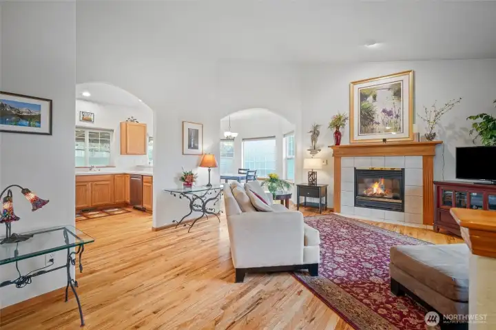 Spacious open-concept layout with hardwood floors.