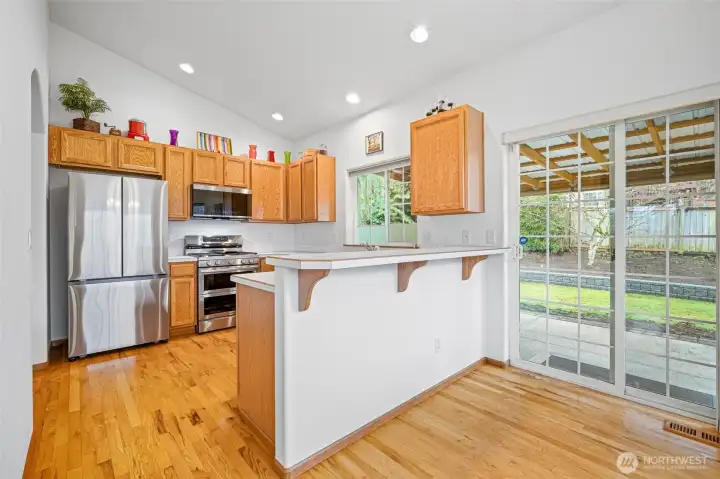 Enjoy a bright breakfast bar area next to the sliding glass doors to the patio.