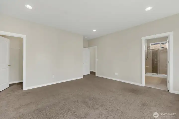 1 of 2 Walk-In Closets in Primary Ensuite