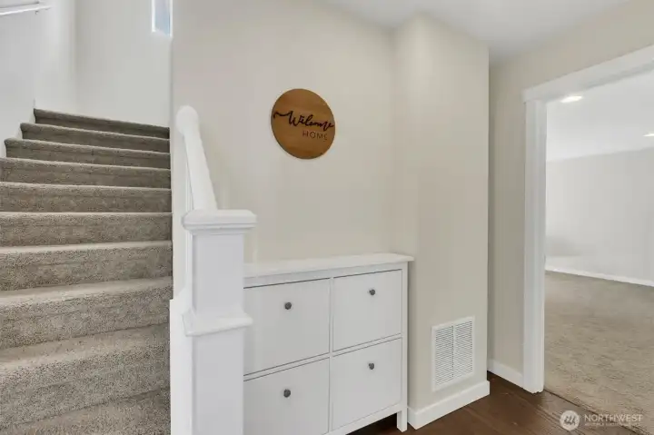 1st Level bedroom and stairs leading to main living space 1st Level bedroom and stairs leading to main living space