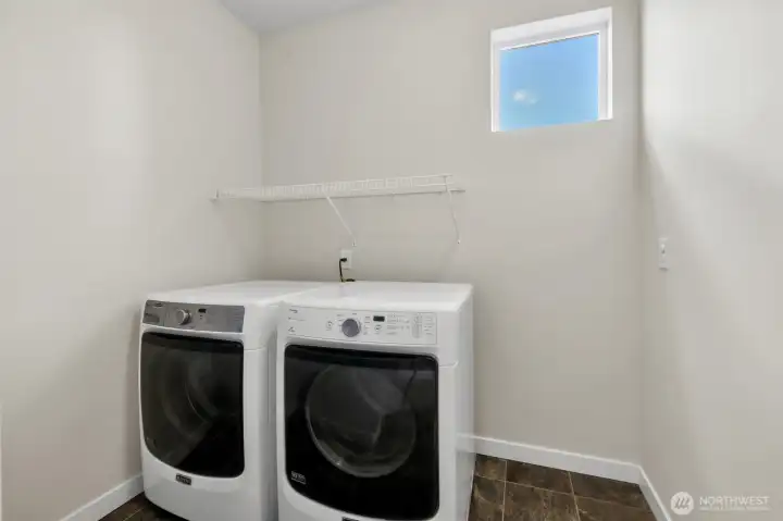 Large laundry room with natural light