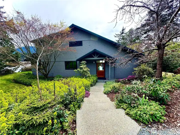 Welcome home. This south facing main house sits at the water's edge and enjoys sweeping views of Eastsound, Buck Mountain, Mt Constitution and East Sound Bay.