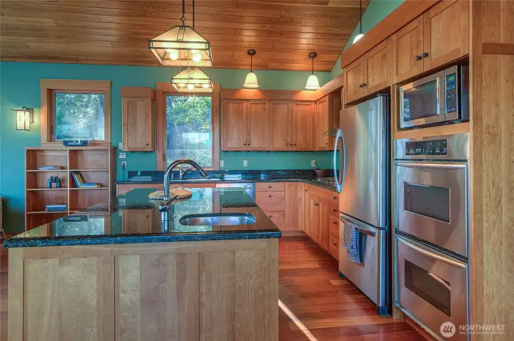 Two sinks, double ovens, cook top, microwave, cherry custom cabinets, granite counters. Let's get cooking!!!!