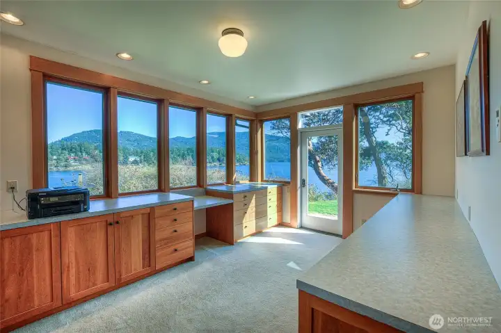 This is the main floor bonus room, current owner used as office space. Nothing but natural light and large water views from this room!! Door accesses patio.