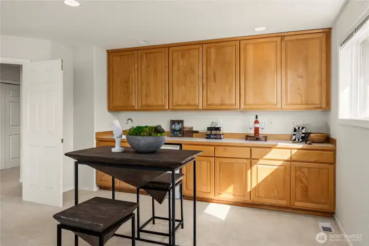 Built ins with wet bar and mini fridge.