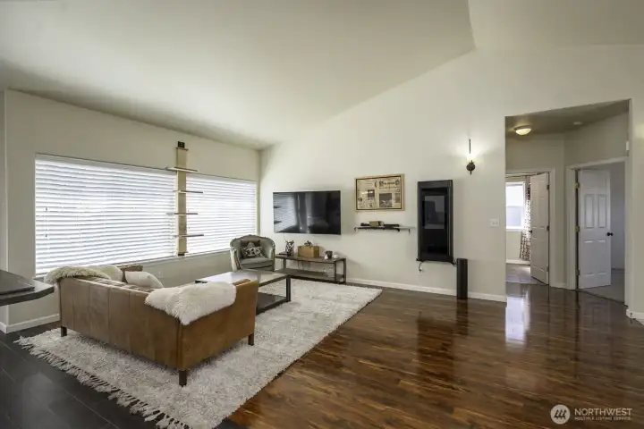 floorpan provides privacy for primary suite with additional bedrooms on the other side of the home