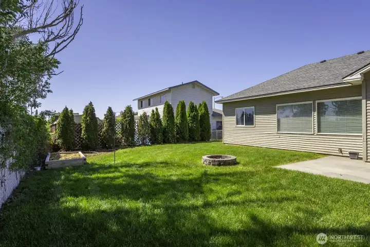 Hedges for additional privacy in the fully fenced back yard